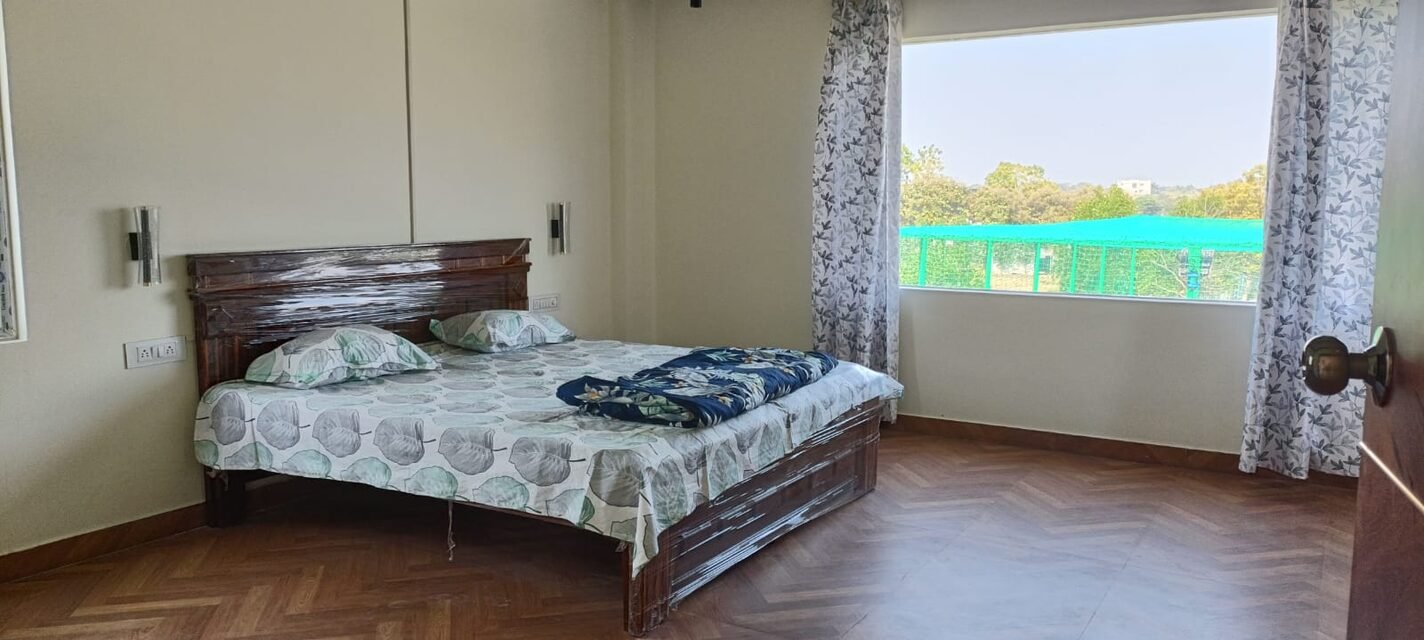 A bedroom looking over the grounds